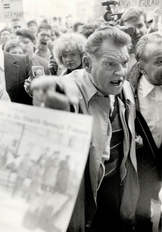 Confrontation: Soviet visitor mingles with students outside Humberside Collegiate while angry demonstrators, inset, protest the visit of delegation from Volgograd