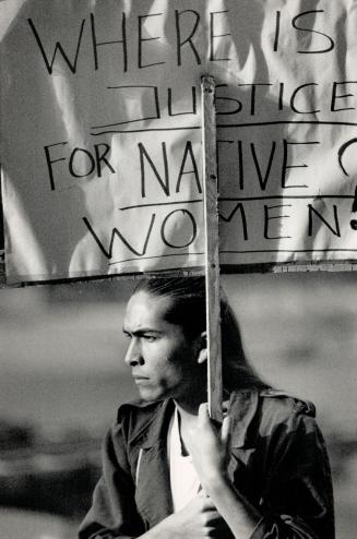 Prison sentence protested, Eric Schweig from the Yukon marches outside old city hall yesterday in protest against the sentence of two years less a day(...)