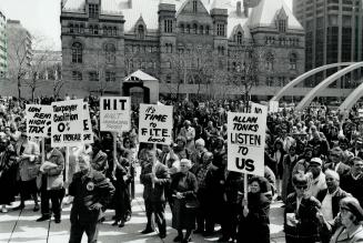 About 450 protesters turn out at Nathan Phillips Square yesterday to rally against municipal tax increases