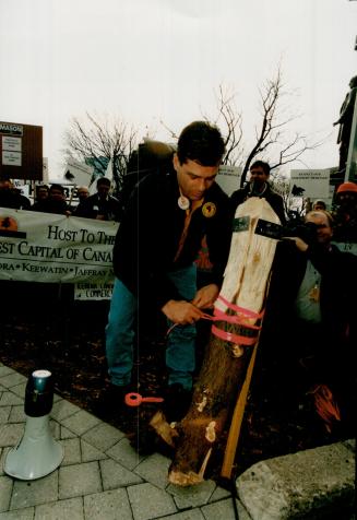 Bold statement: Timmins prospector Jack Robert stakes a claim on the front lawn of Queen's Park during a rally earlier this month by 400 northern workers in support of Lands for Life