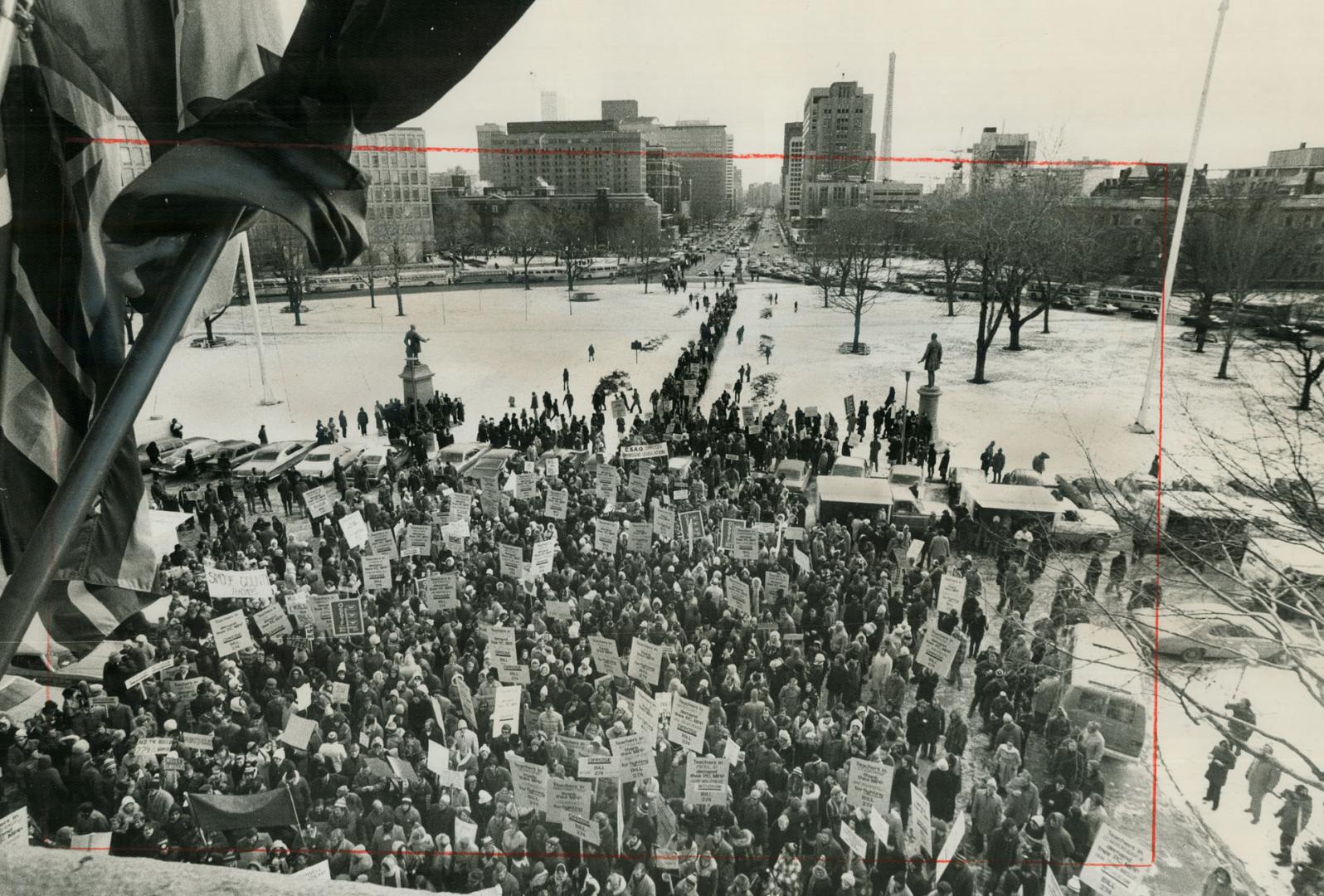 Forest of Placards are raised today at gigantic rally of Metro teachers at Queen's Park in a mass demonstration against the Ontario government's bill (...)