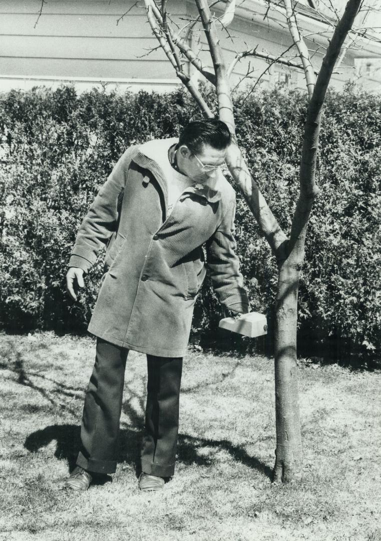 7. Stuart Morley taking reading in the Pearson backyard