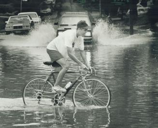 Aaron Clark, 18, finds the going tough on his way home as he crosses the bottom of Lee Ave