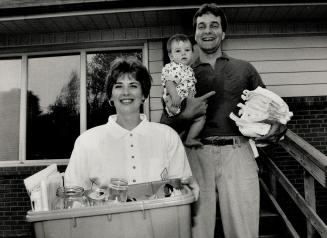 Ecological heroes: Elizabeth and Jim Knowiton of Oakville have made significant reductions in their household garbage with recycling, composting and by using cloth diapers for son, Mathew