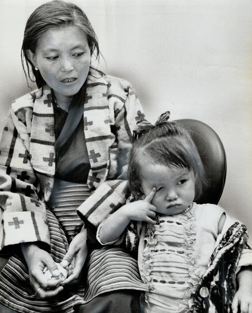 A sleepy Tibetan immigrant, 3-year-old Decki Jamewangyal waits with her mother in the immigration area at Toronto International Airport last night aft(...)