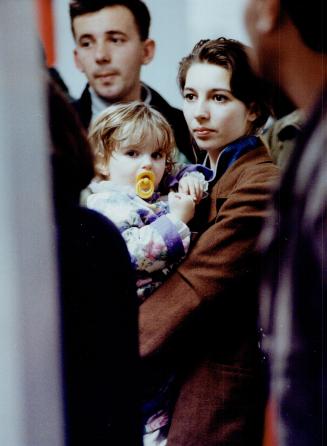 Some of the 46 Bosnian refugees who arrived at Pearson airport last night await processing by immigration officials