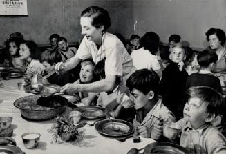 Doll, seen acting as a waitress