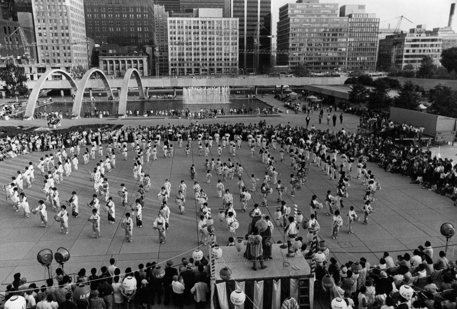 Toronto Buddhists hold festival, Swaying to the strains of eastern music, 150 dancers in concentric circles perform a traditional dance as they mark t(...)