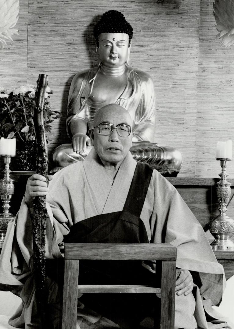 Zen master: Statue of the Buddha in a Toronto temple gazes down on Wolha Sunim, visiting patriarch of a 1,300-year-old Zen Buddhist monastry in South Korea