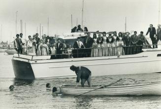 olymenakos, president of hausted Greek divers are nd a 10-inch, gold-plated cross thrown into the water