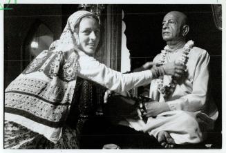 Parade ready: Indulekha Dasi adjusts a floral adornment for a statue of Srila Prabhuda, founder of the International Society for Krishna Consciousness