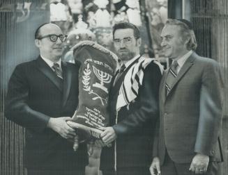 New Torah Scroll that will be ceremonially presented to Beth Emeth Bais Yehuda Synagogue tomorrow is held by Barney Barenholtz, left, and Rabbi Josep(...)