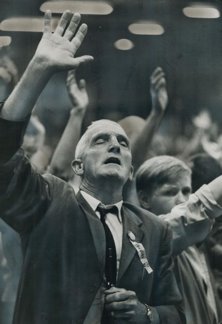 A Man speaks with tongues at a 1966 Toronto rally