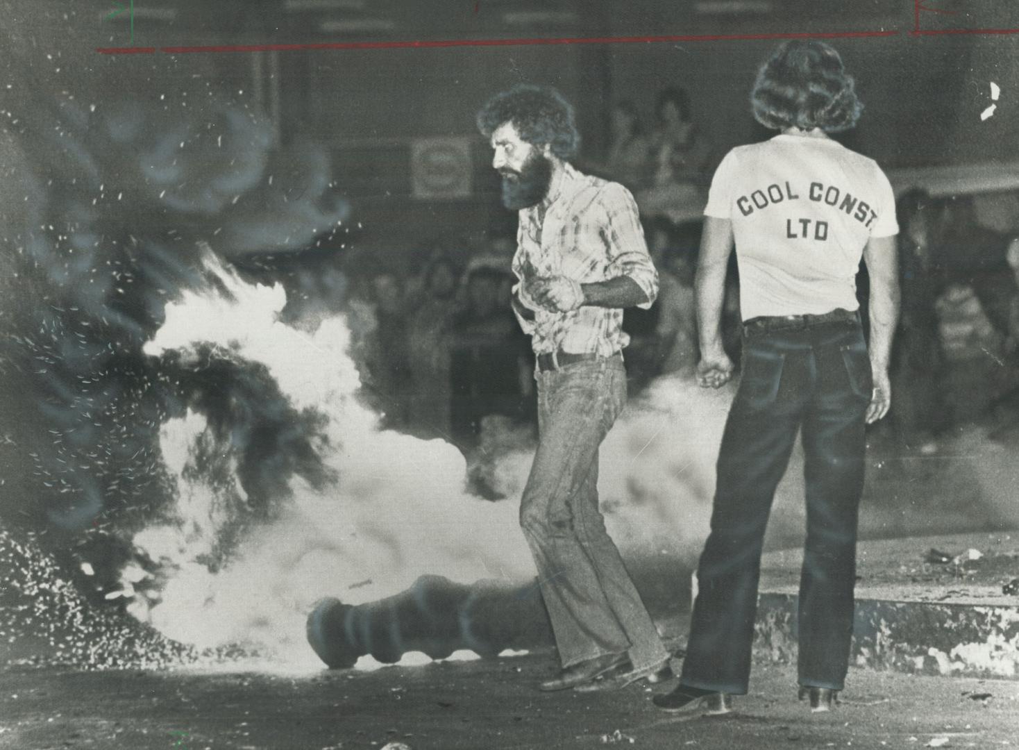 Rowdies dancing in flames of burning tires in Bathurst last night