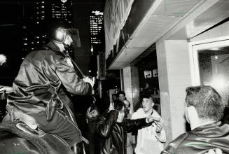 Not control: A mounted Metro police officer moves into action against youths during yesterday's riot through downtown streets