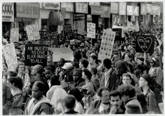 Angry protest: Demonstrators pack the streets downtown as part of a huge protest that turned violent yesterday