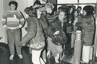 Early birds charge through the turnstiles for first pick of the bargains at the 62nd annual Hadassah Bazaar at Exhibition Place today. Eager buyers li(...)