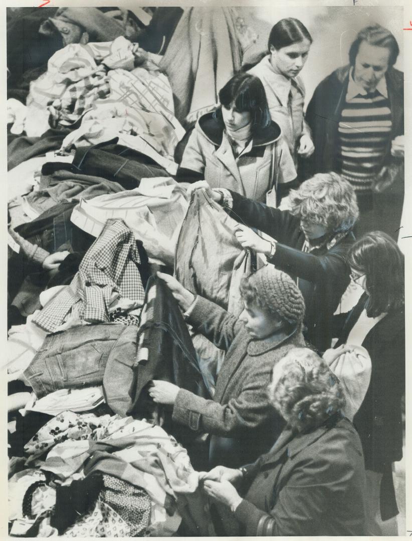 Bargain hunters lose themselves in piles of merchandise at annual Hadassah Bazaar yesterday