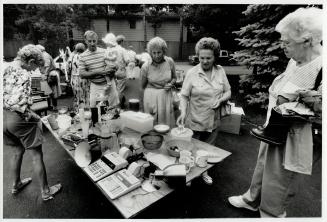 And, right, would-be customers peruse the bargains at Dr. Bonny's sale