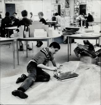 John Crossley, 13, in the senior division of Meadowbrook School, Newmarket, finds painting is his thing while classmates pursue other projects. Teache(...)