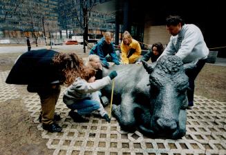 St. Mildered's Light Bourn Oakville, Emily Budd and fellow students, teacher Ron Lancaster measure sculpture