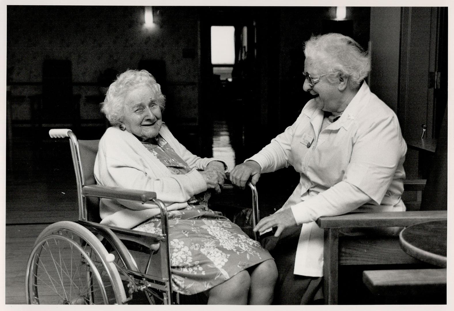 Friendly face: Jean St. Steventon, 74, right, keeps 97-year-old Gladys Russell smiling at Castleview Wychwood Towers, a home for the aged. St. Stevenson runs the tuck shop there