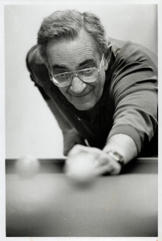 Top, Hy Fogelman takes aim, and above, bingo at the Parkview House co-operative where seniors help each other maintain independence, and fight isolation and loneliness