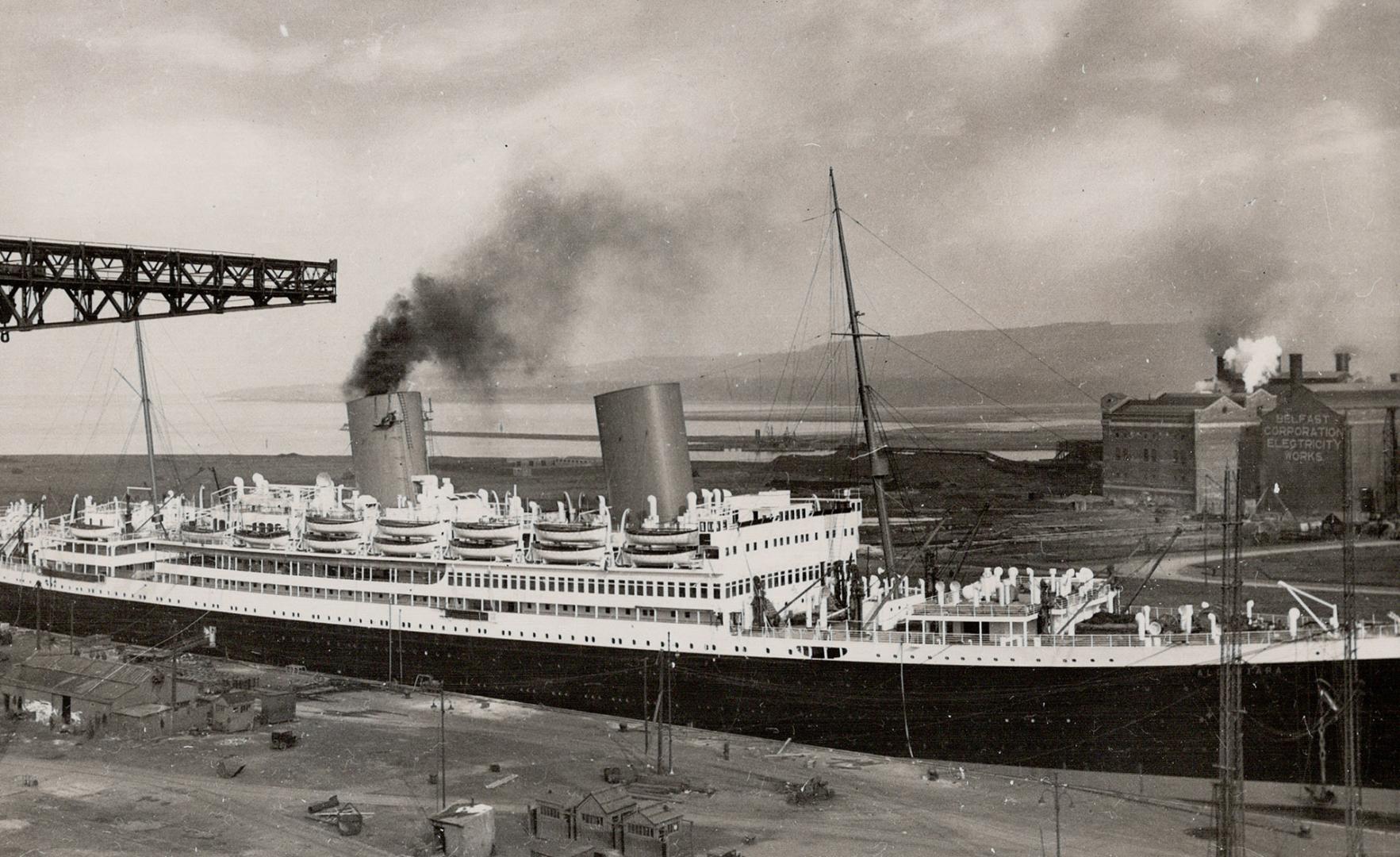 The S.S. Alcantara has been fitted with steam turbines and is ready for service. Here is the liner in the fitting out wharf at Belfast