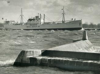 Racing winter to the sea. As ice begins to form on the waterfront, the Swedish freighter Borgholm clears Toronto in a race against the freeze-up. Lock(...)