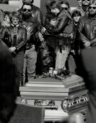 Gone Forever. Lorie Ryerse is hugged by a friend at the funeral of her husband, Dean Felker, 28, who, with John Walsh, 19, and Gary Speight, 49, was b(...)