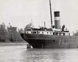 Ensign at half-mast in mourning for her sister ship lost in Lake Superior, the C