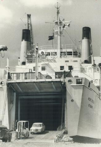 Open your mouth and say aah, Unloading the Swedish ship Royal is as easy as driving a car