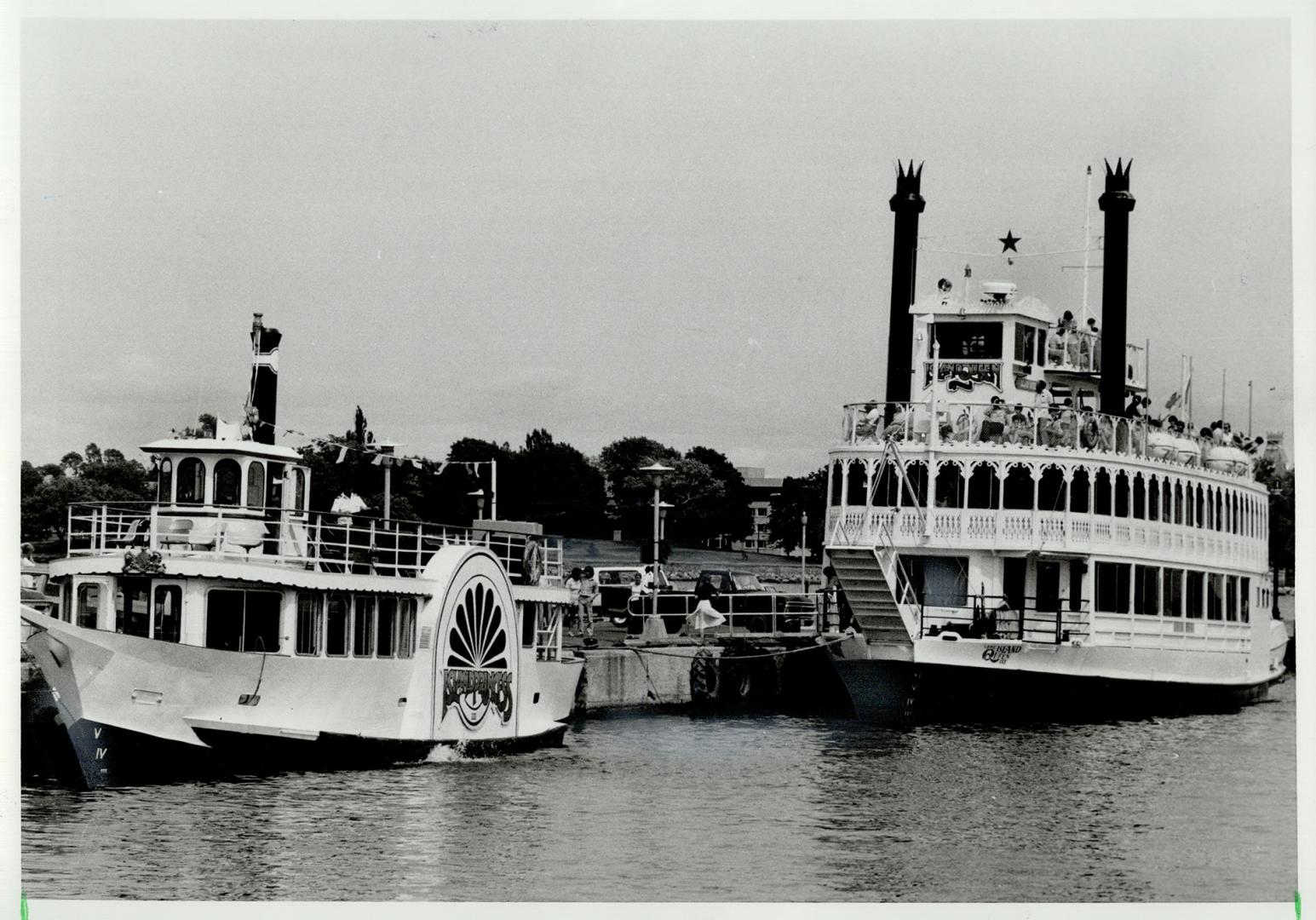 Busting waterfront: Boats of all sizes and shapes, from the tourist paddle-wheelers to private sailboats docked in front of city hall, help keep Kingston's business booming