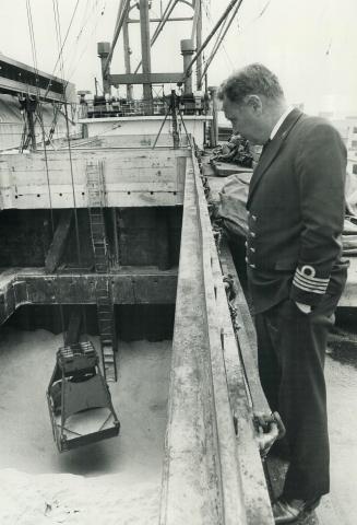 Another shipload of sweetness, Giant scoop unloads a cargo of West Indies sugar at the Redpath Refinery dock of Canada and Dominion Sugar Company on T(...)