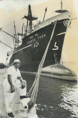 Ship here on maiden voyage, Boatswain Bejoy Banearjee of the Indian ship Vishya Yash looks at the Toronto skyline from the pier at the bow of the ship(...)