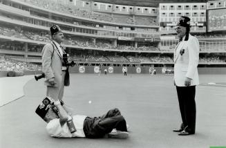 Imperial Potentate Edward G. McMullan of Calgary, right, poses on field