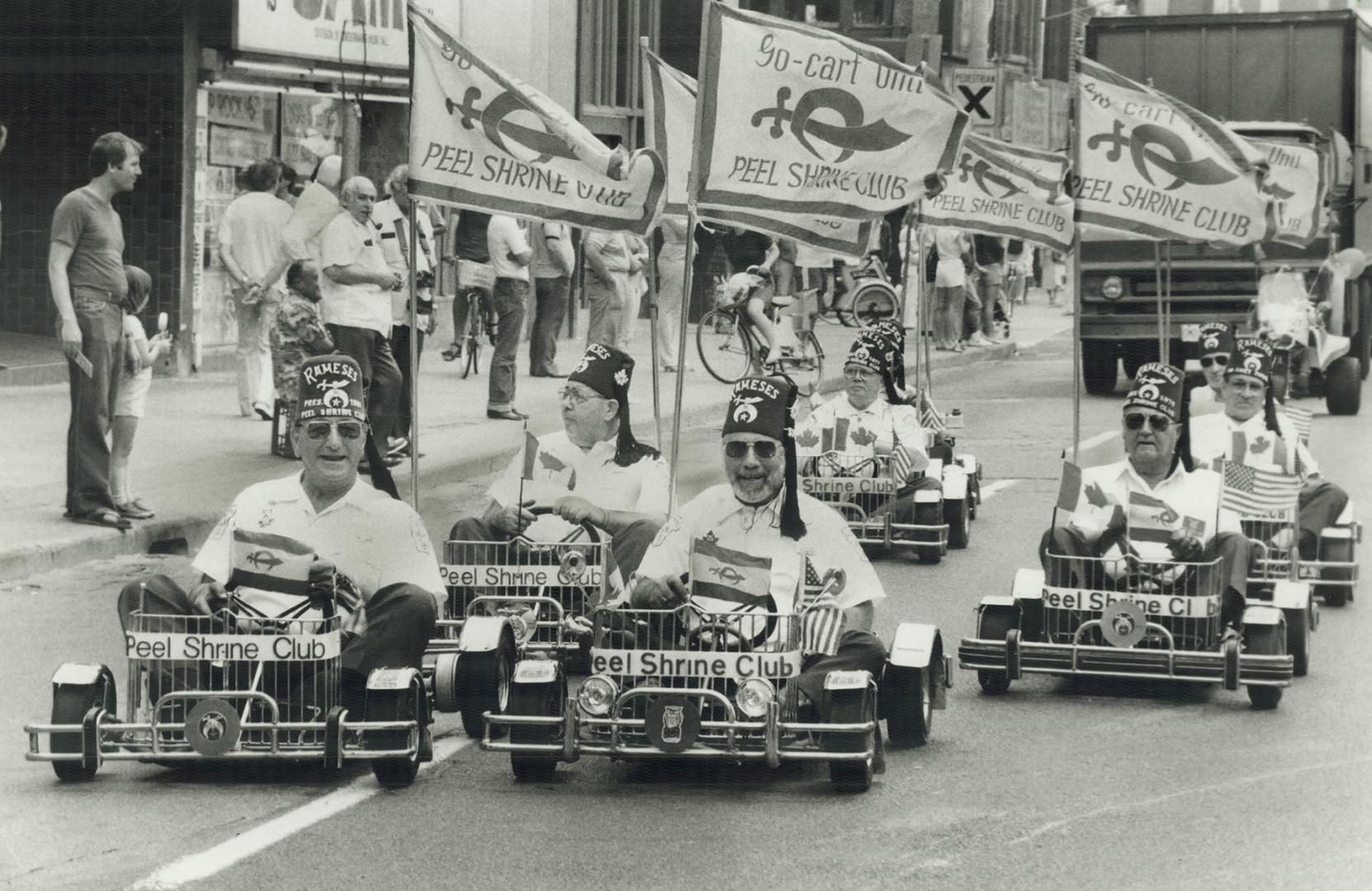 Parade of shriners says it's circus time! The first annual Shrine Circus parade - including 35 units of marching bands, drill teams and motorcades - w(...)