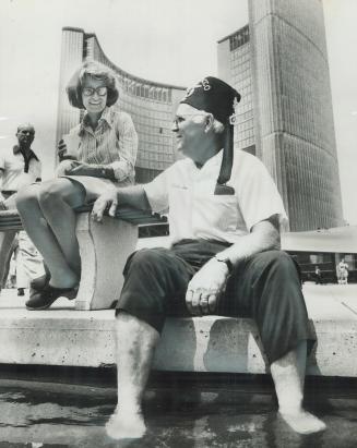 Exploring Toronto on foot was hard on the feet in yesterday's heat, and Shriner Bill Gouchnour, a member of Morocco Temple band in Jacksonville, Fla.,(...)