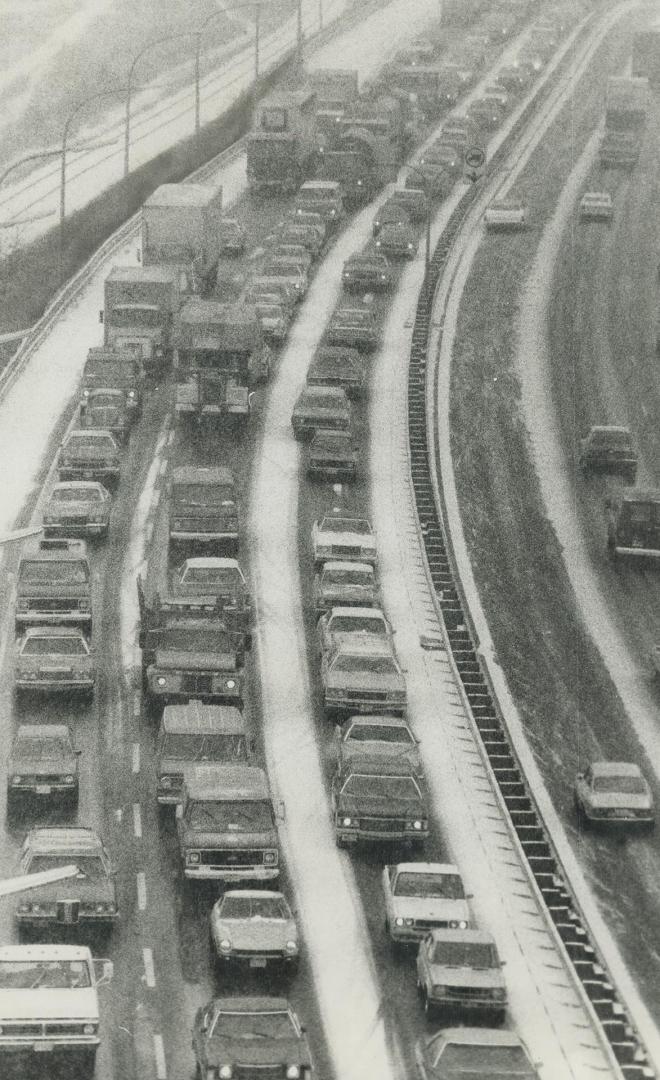 Traffic on southbound lanes of Don Valey Parkway came to a virtual halt around noon today after a truck and a car collided on the snowy pavement south(...)