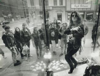 On dancer! On prancer!, Nancy Vascotto dances yesterday In the window of Jingle Bell Rock, a temporary shop set up on Yonge St. downtown by radio stat(...)