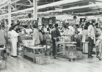 Shoppers line up, above, at Knob Hill Farm, one of several supermarkets open on Sunday