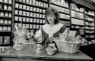 Mix and match, Cobi Ladner, who manages a Crabtree & Evelyn shop, makes up a basket of goodies for Mother's Day