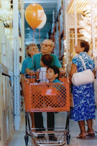 Grand opening: Leonard and Blanche Levac Shop with grandchildren Eric, 4, and Sean, 2, at the grand opening yesterday of the Home Depot store in Mississauge