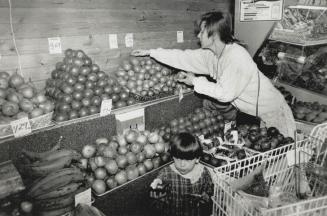 Less for more: Kathy Alaouze and Madeleine, 3, would rather pay more money for fewer chemicals in their produce at the Alternatives store in Oakville