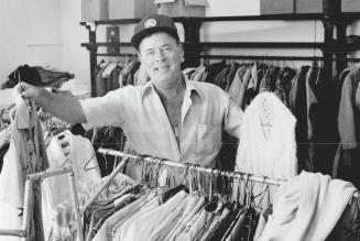 Used clothing needed, John Mason, a volunteer for West Hill Community Services, Inspects a rack of nearly new clothing available for needy people, suc(...)