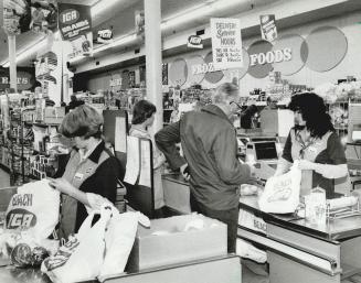 Business as usual: It was just another busy day yesterday at the Beach IGA, where store manager Al Linton says, it's (Sunday opening) what the people seem to want