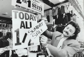 Assistant manager Robert Brescacin in on the job at his Eaton Centre store