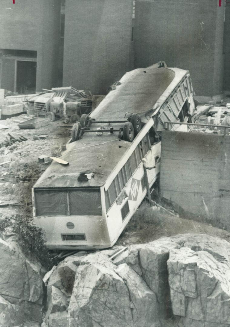 Overturned trailer, used as a field office, lies on its roof besides the giant International Nickel Co