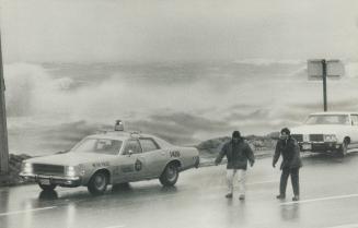 Policemen were blown off their feet as they tried to re-direct traffic along Lake Shore Blvd