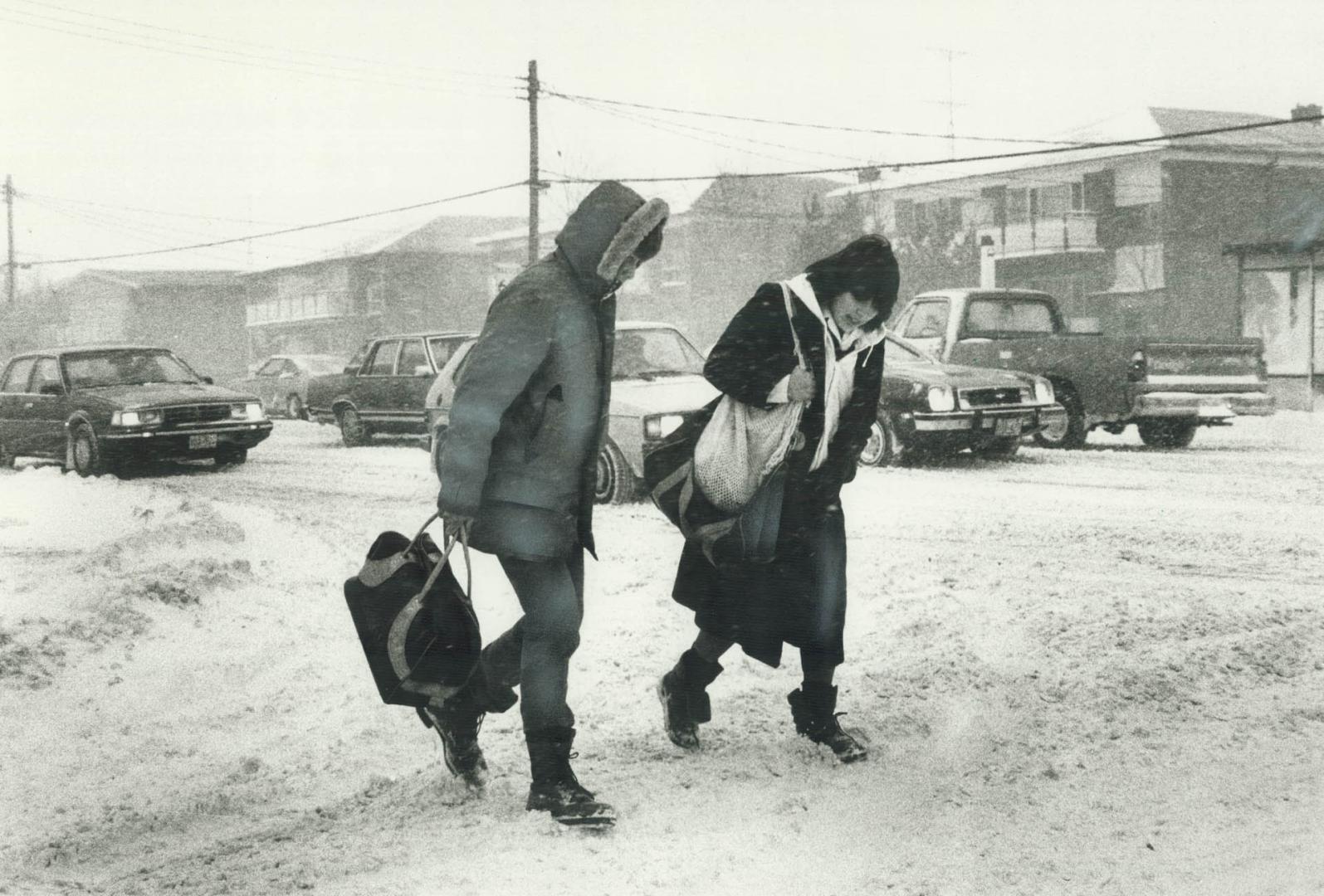 Two Scarborough residents brave the howling winds and driving snow